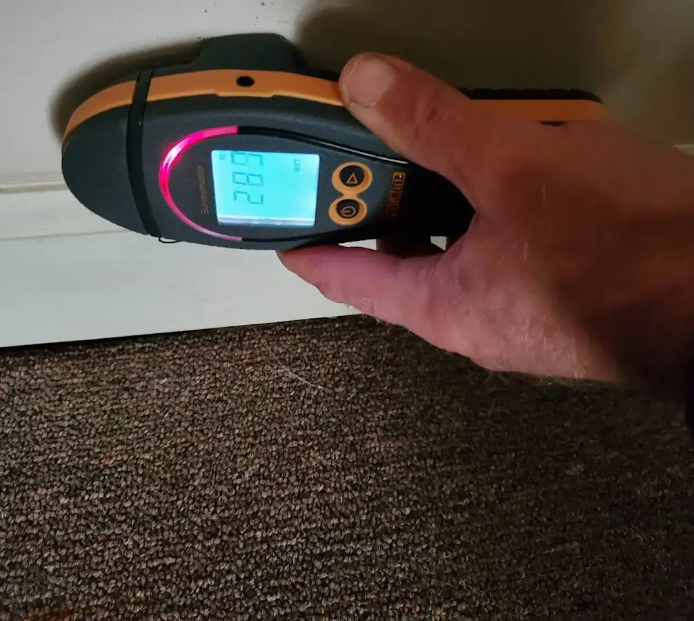 Moisture detection at baseboard during Storm Damage Restoration in Suffield